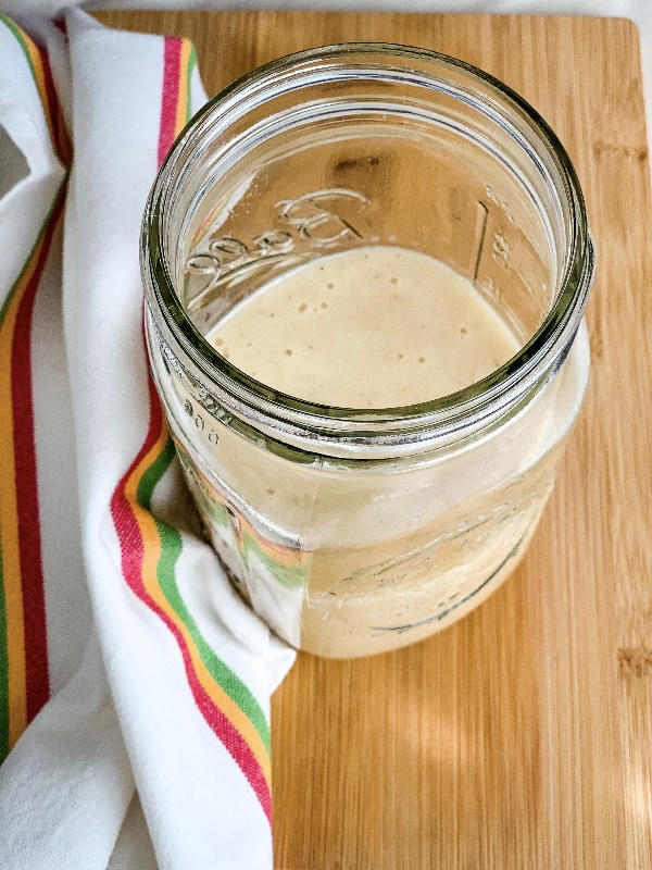 glass jar containing homemade gluten free cream of chicken soup