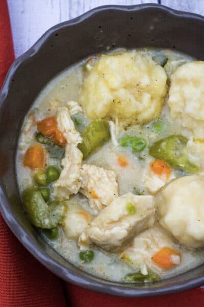 chicken and gluten free dumplings in a brown bowl