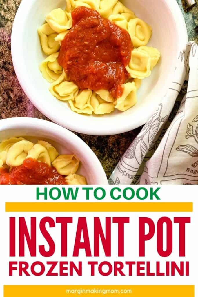 two white bowls filled with tortellini that was cooked in the Instant Pot, topped with marinara sauce