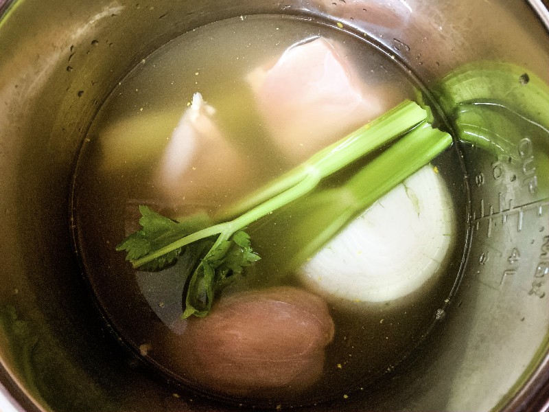 chicken, celery, onion, and broth for making chicken and dumplings