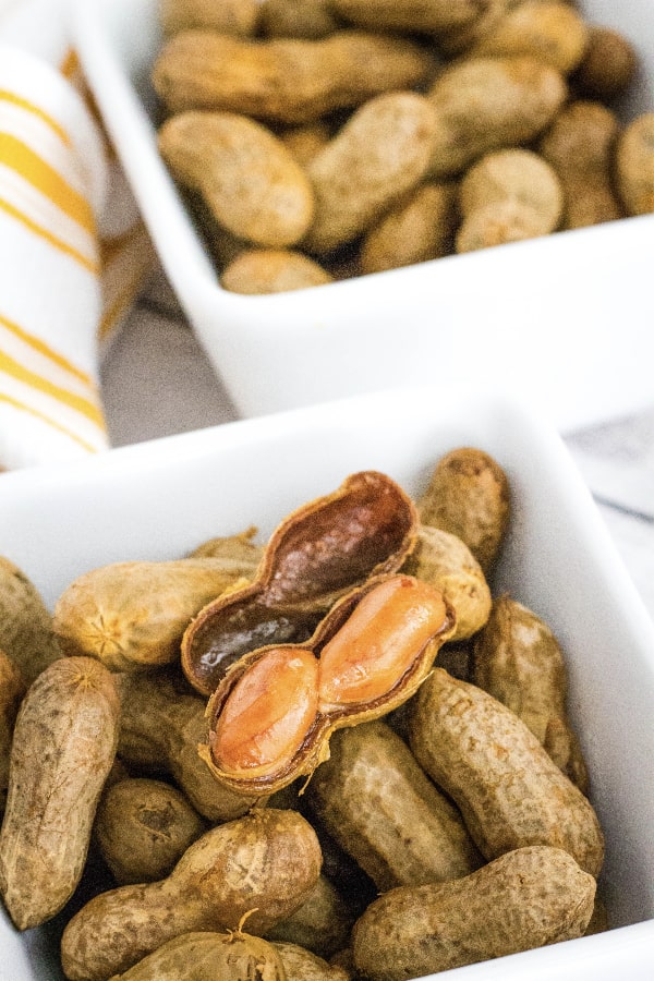 white square bowl of boiled peanuts