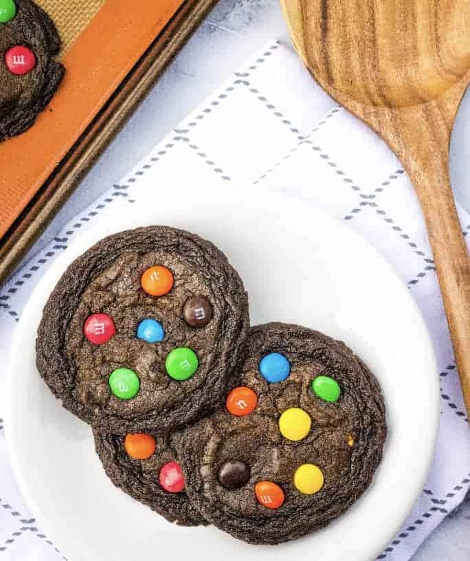 white plate with M&M brownie mix cookies