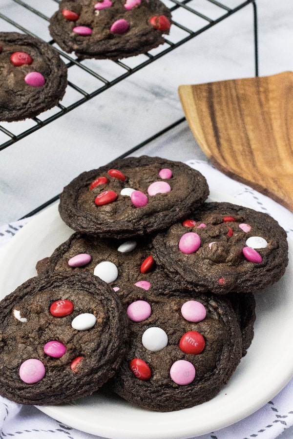 brownie mix cookies with Valentine's M&Ms in them, on a white plate