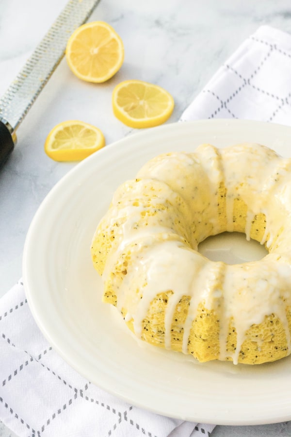 Lemon poppy seed bundt cake on a white plate