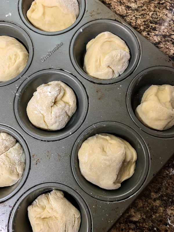 frozen dinner rolls in a muffin tin