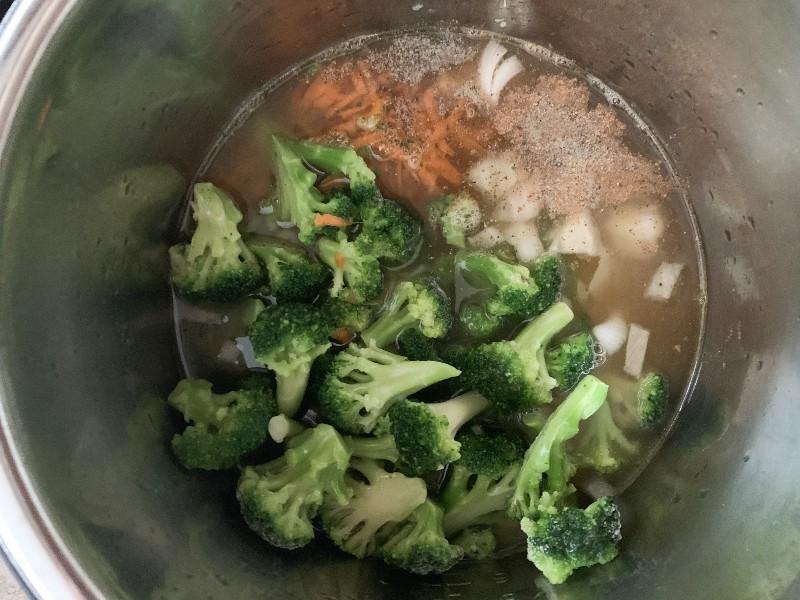 frozen broccoli, shredded carrots, and other ingredients for broccoli cheese soup