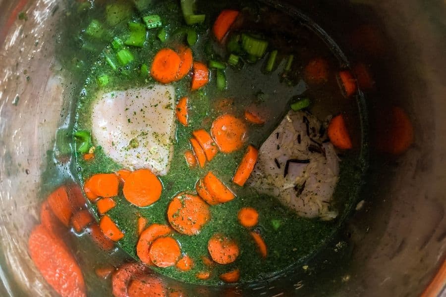 chicken breast, vegetables, water, rice, seasoning packet in the Instant Pot