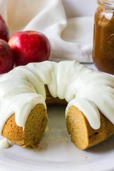 bundt cake made with apple butter and topped with cream cheese frosting