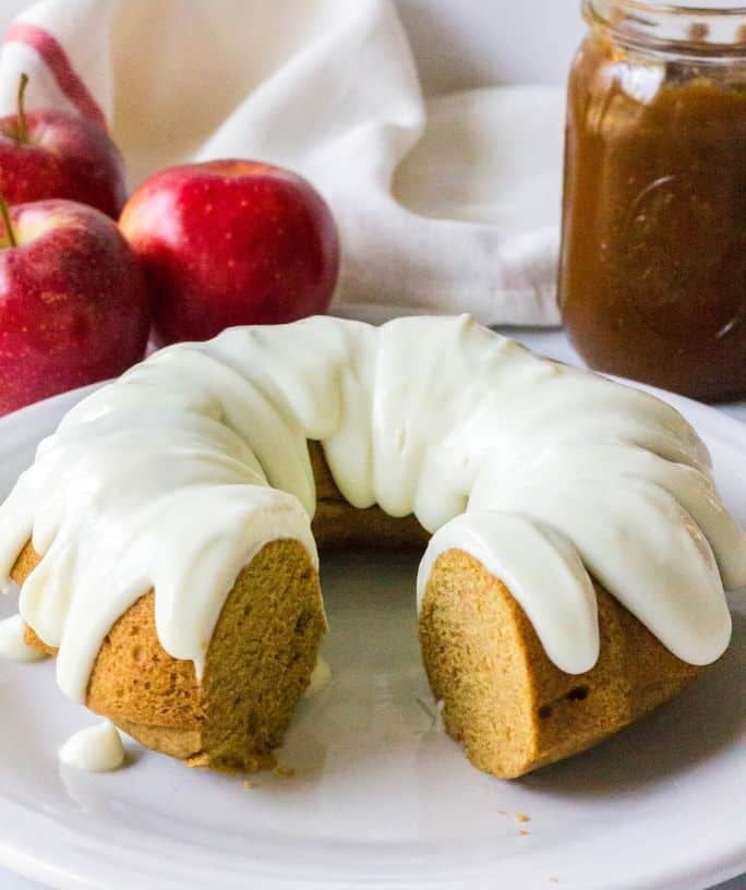 bundt cake made with apple butter and topped with cream cheese frosting