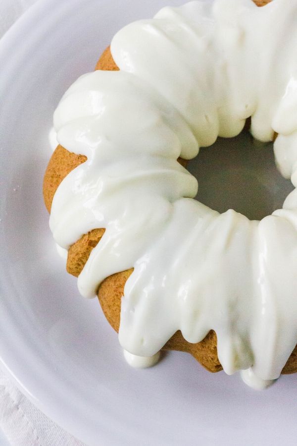 whole apple butter cake topped with cream cheese icing