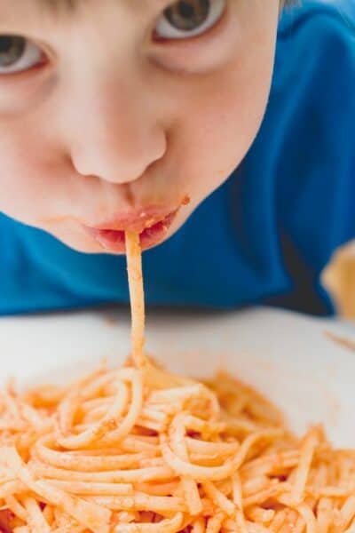 boy eating spaghetti