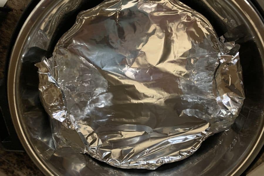 foil-covered cake pan in the Instant Pot