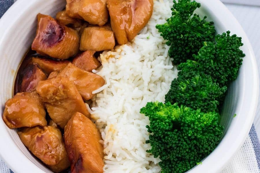 white bowl with teriyaki chicken, white rice, and steamed broccoli
