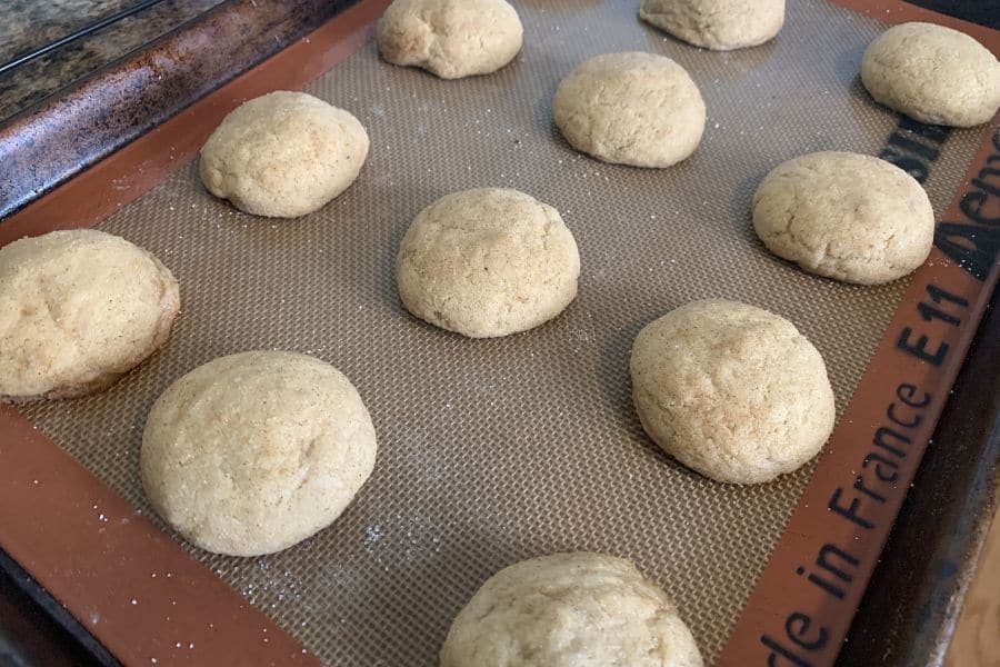 freshly baked apple butter snickerdoodles on a baking sheet