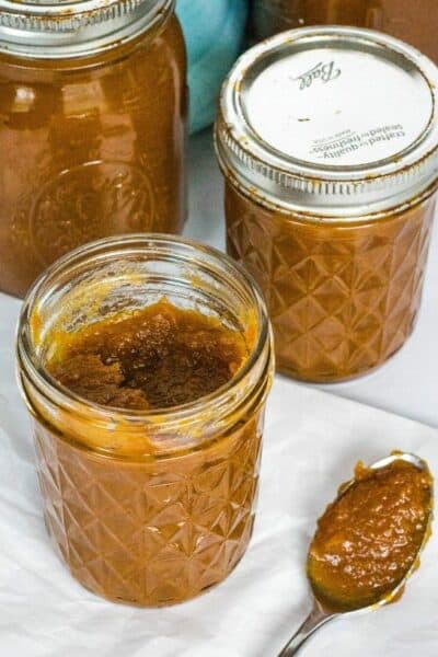 three jars of pumpkin apple butter that was cooked in the Instant Pot