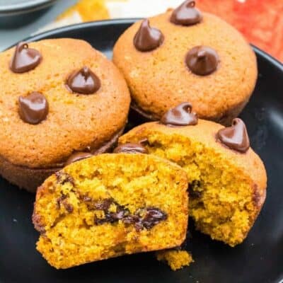 plate full of pumpkin muffins with chocolate chips