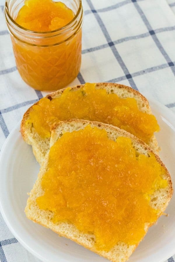 two slices of sourdough bread spread with homemade pineapple jam