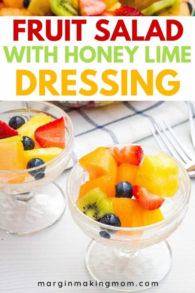 two glass dessert cups filled with honey lime fruit salad