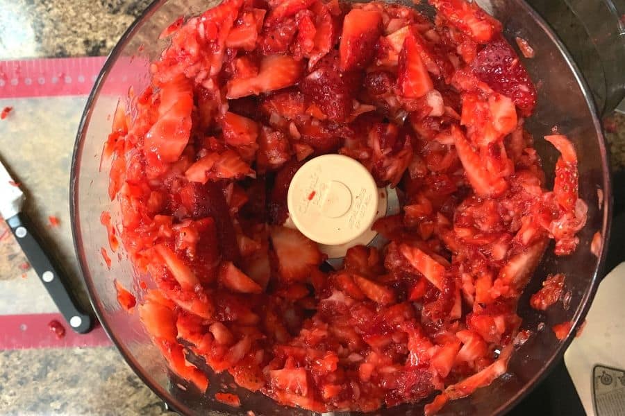 chopped strawberries in a food processor