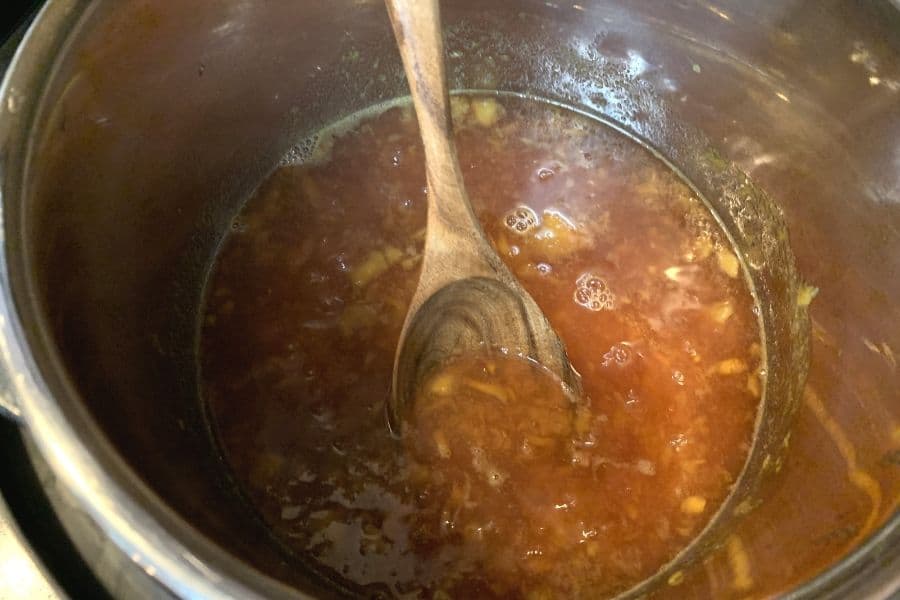 peach jam simmering in the Instant Pot