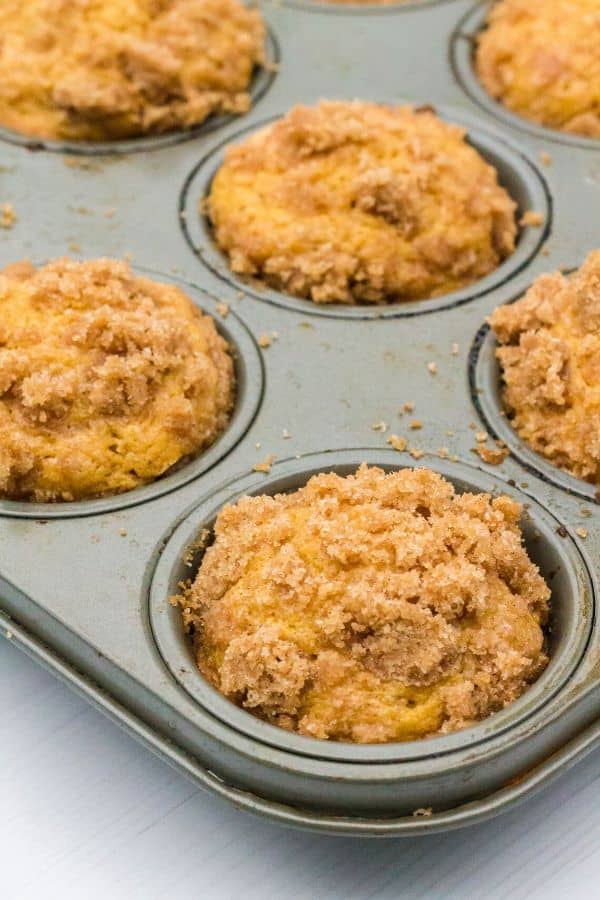 pumpkin banana muffins topped with streusel in a baking pan