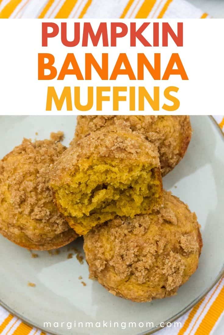 Four pumpkin banana muffins on a plate, with one muffin torn in half.