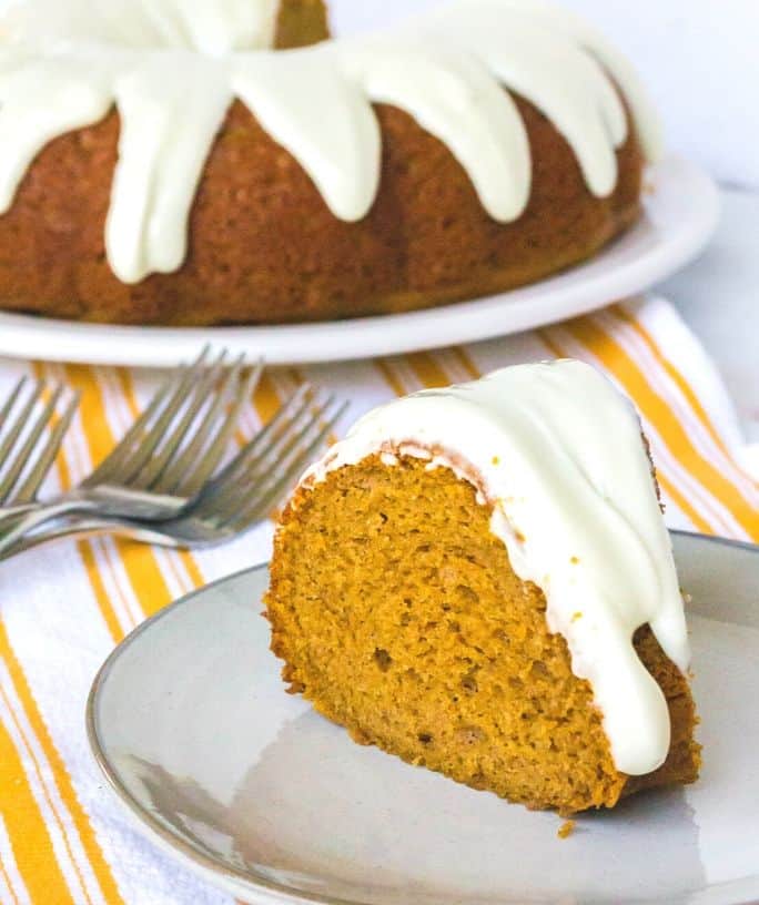 slice of pumpkin spice bundt cake on a serving plate