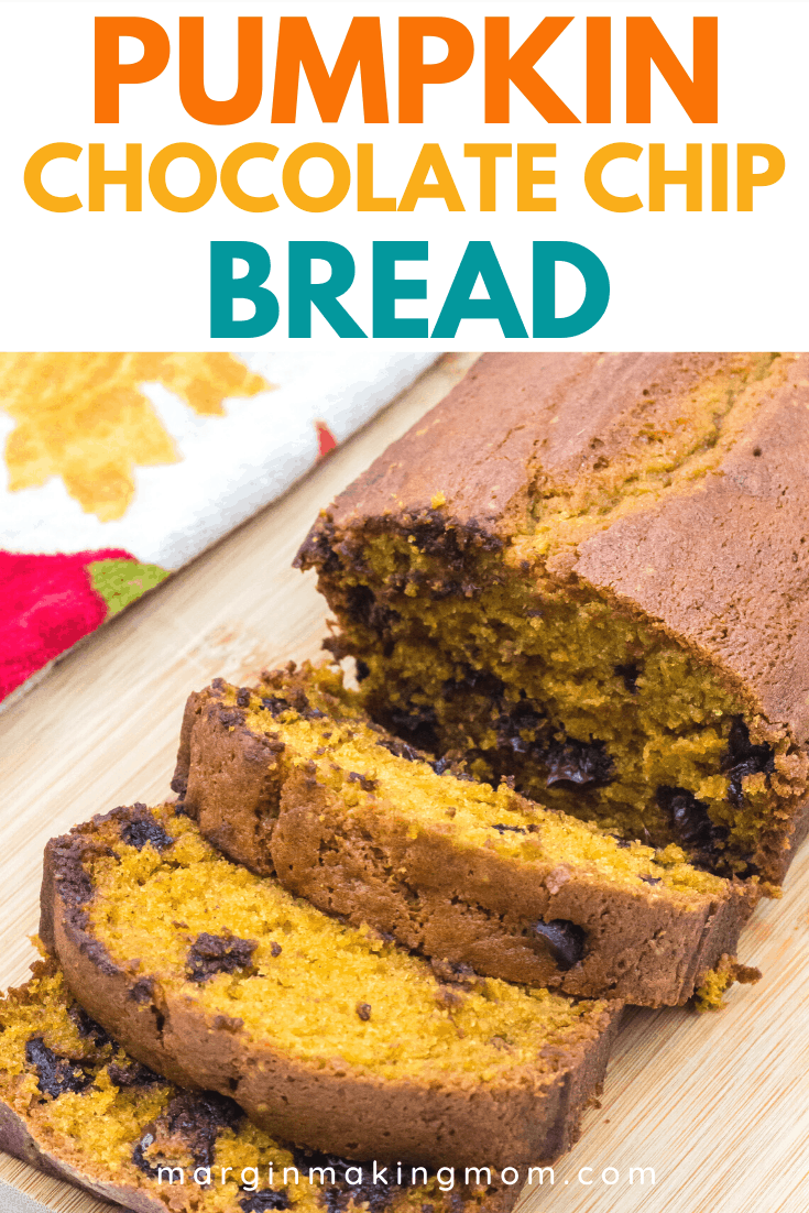 sliced loaf of pumpkin chocolate chip bread on a cutting board