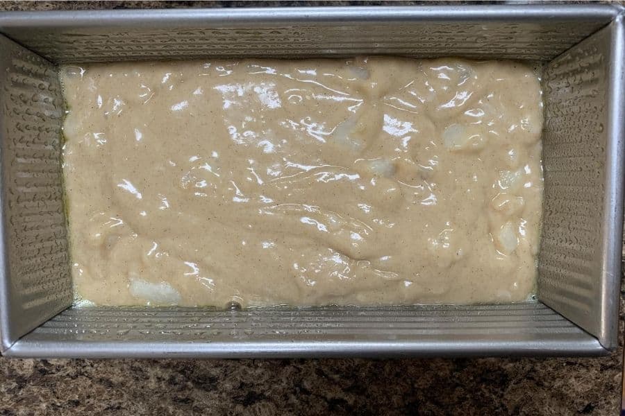 spiced pear bread batter in a loaf pan