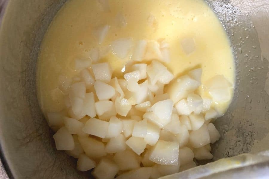 wet ingredients for pear bread in the bowl of a stand mixer