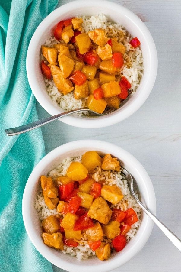 two white bowls of rice and Hawaiian chicken, all of which was cooked in the Instant Pot