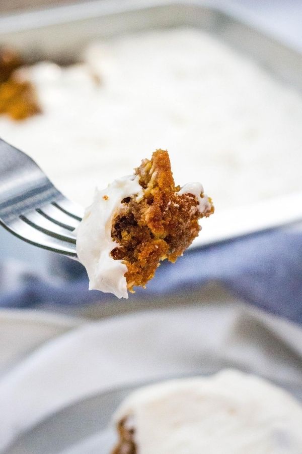 a fork lifting a bite of an oatmeal cream pie cookie bar