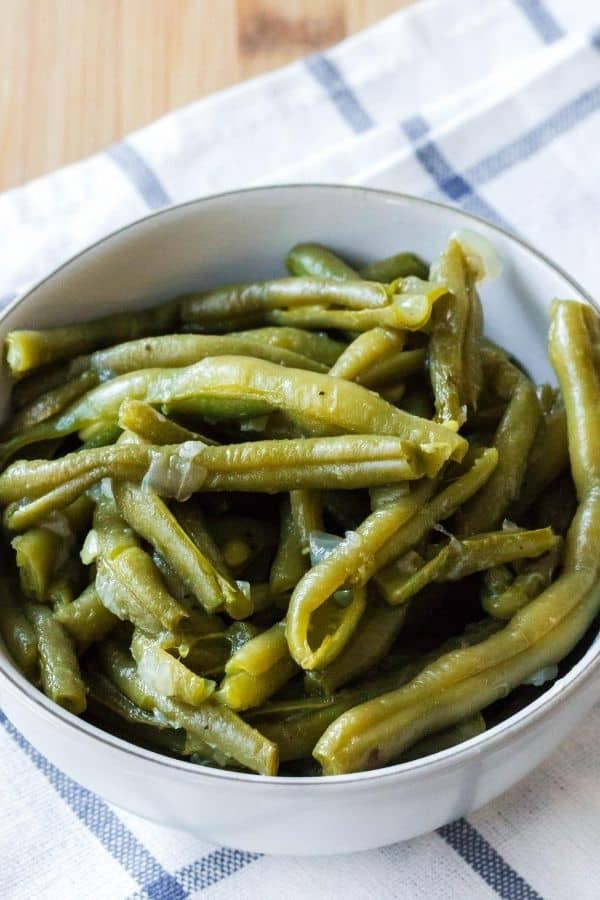 a mouthwatering bowl of southern style green beans that were cooked in the Instant Pot pressure cooker