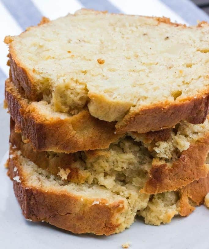 stacked slices of banana pear bread on an appetizer plate