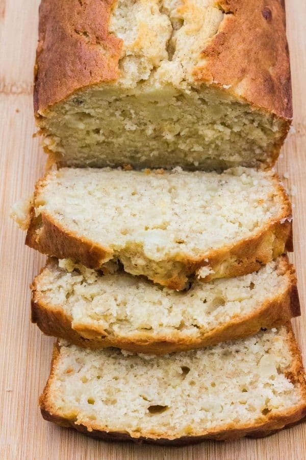 Sliced pear banana loaf on a cutting board