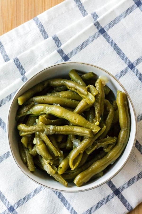 a bowl of fresh green beans that were cooked in the pressure cooker