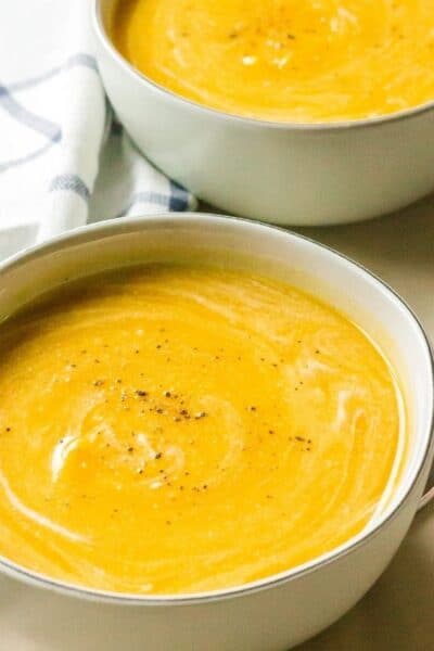 two bowls of butternut squash soup cooked in the Instant Pot