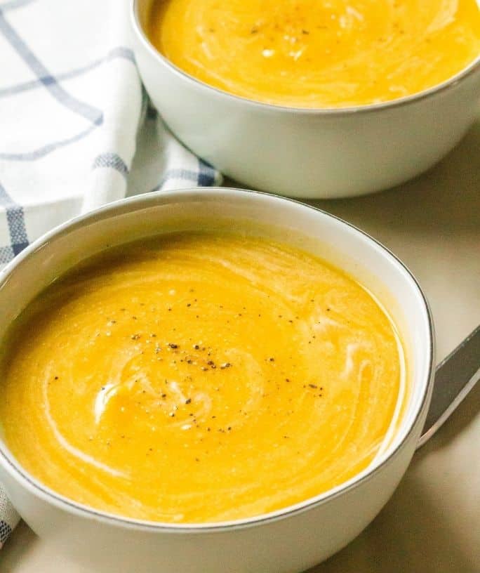 two bowls of butternut squash soup cooked in the Instant Pot