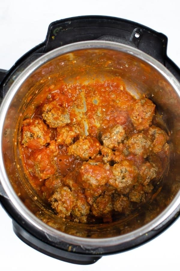 meatballs and sauce in the Instant Pot, ready to be spooned onto hoagie rolls