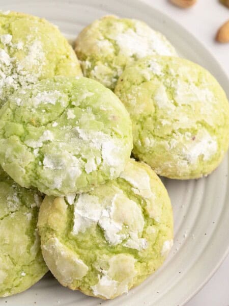 a plate of several pistachio pudding cookies.