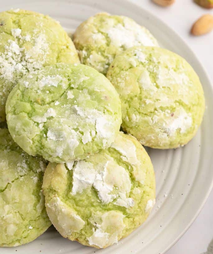 a plate of several pistachio pudding cookies.