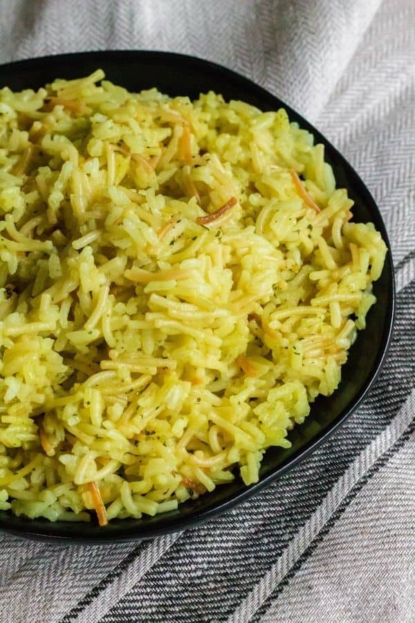 Chicken Rice a Roni cooked in the Instant Pot pressure cooker, served on a black plate