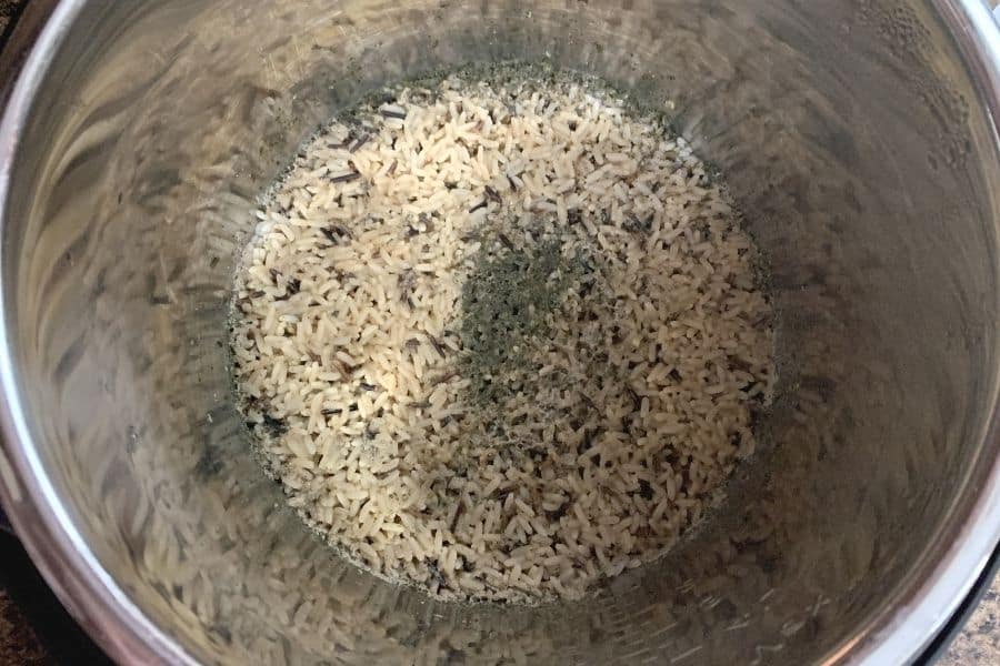 freshly cooked Instant Pot wild rice that hasn't been fluffed yet