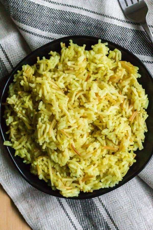 a serving of chicken Rice-a-Roni that was cooked in the Instant Pot, plated on a black plate