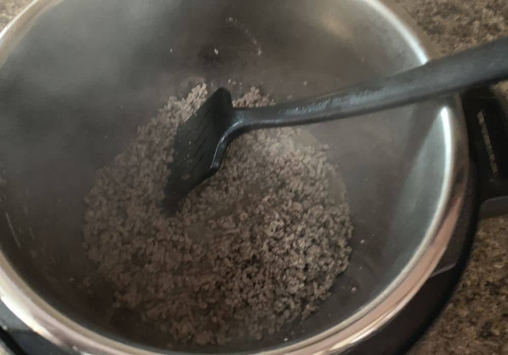 browned ground beef in the Instant Pot for making Cincinnati chili.