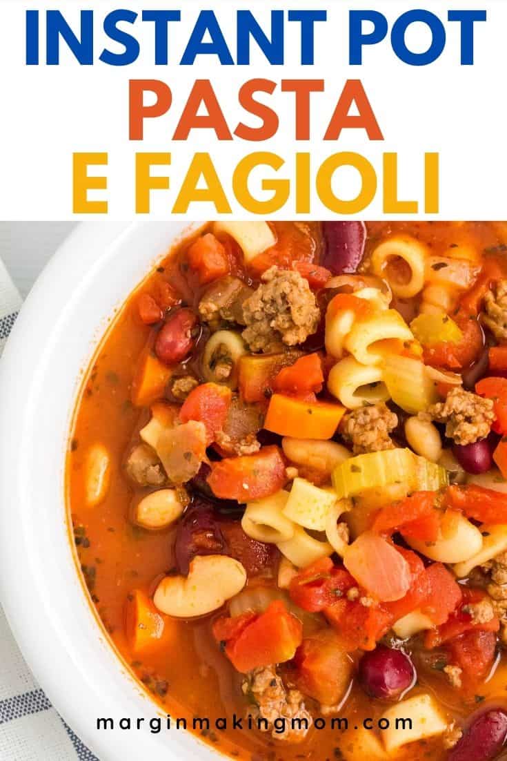 close-up view of a white bowl filled with Instant Pot pasta e fagioli soup