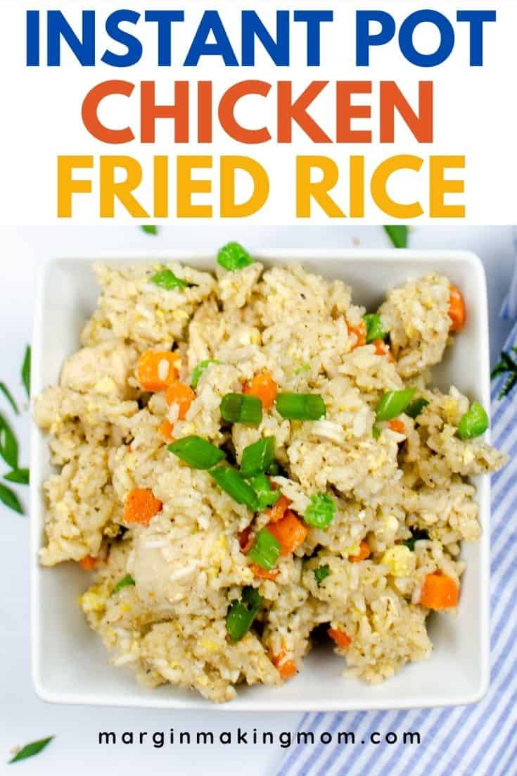 White square bowl filled with Instant Pot chicken fried rice, next to a blue and white striped hand towel