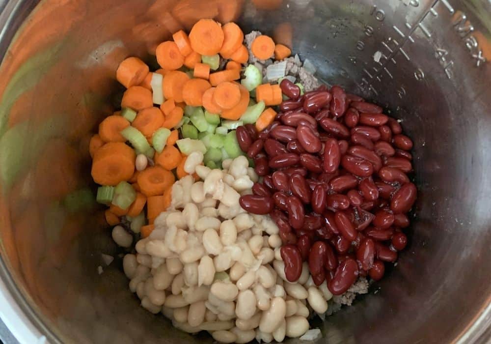 kidney beans, northern beans, carrots, and celery in the Instant Pot for making pasta e fagioli soup