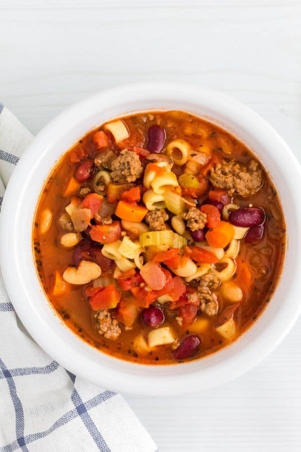 easy pasta e fagioli soup that was cooked in the pressure cooker, served in a white bowl