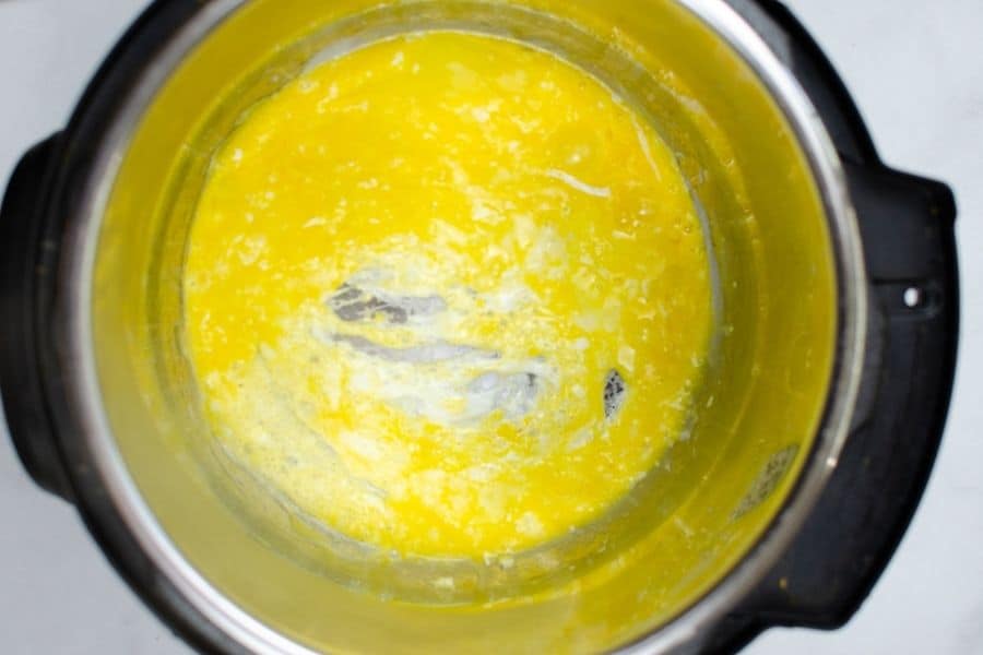 eggs being scrambled in the insert pot of an Instant Pot, to be used in chicken fried rice
